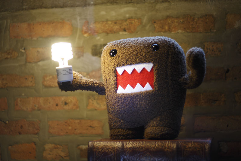 stuffed creature holding lightbulb