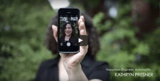 Kathryn holding up iPhone