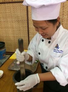 chef pounding ingredients