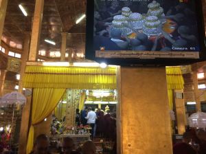 video showing gold leaf being put in Buddhas