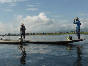man standing on boat