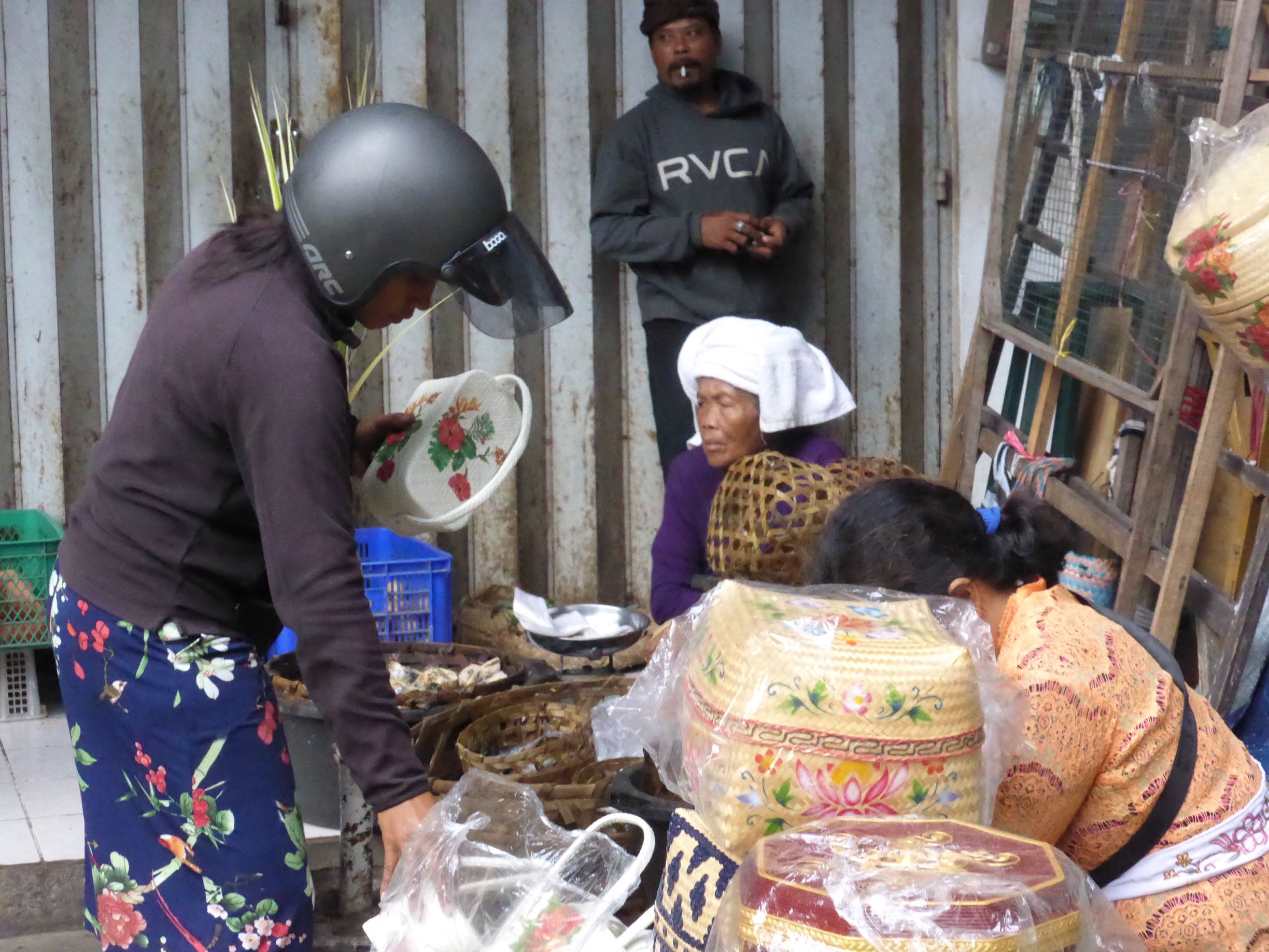 woman in scooter helmet and woman with towel on head