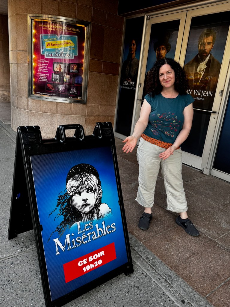 Kathryn in front of Les Misérables sign at Théatre St. Denis